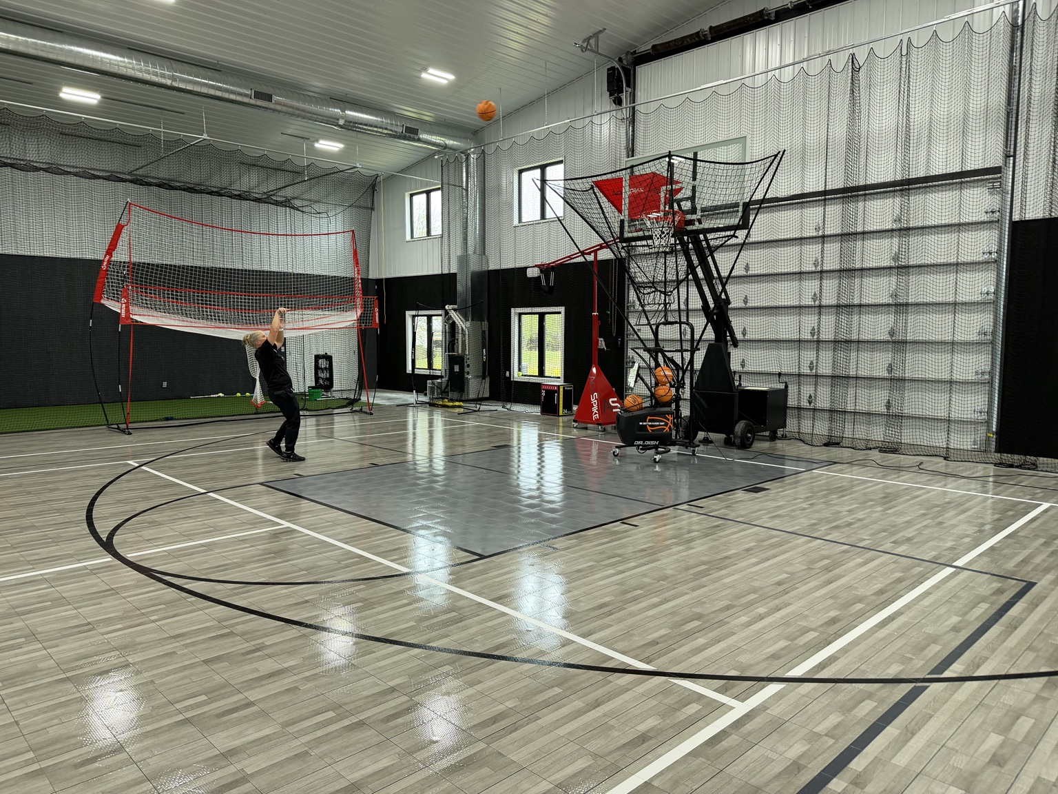 Player training with the Dr. Dish automated basketball shooting machine